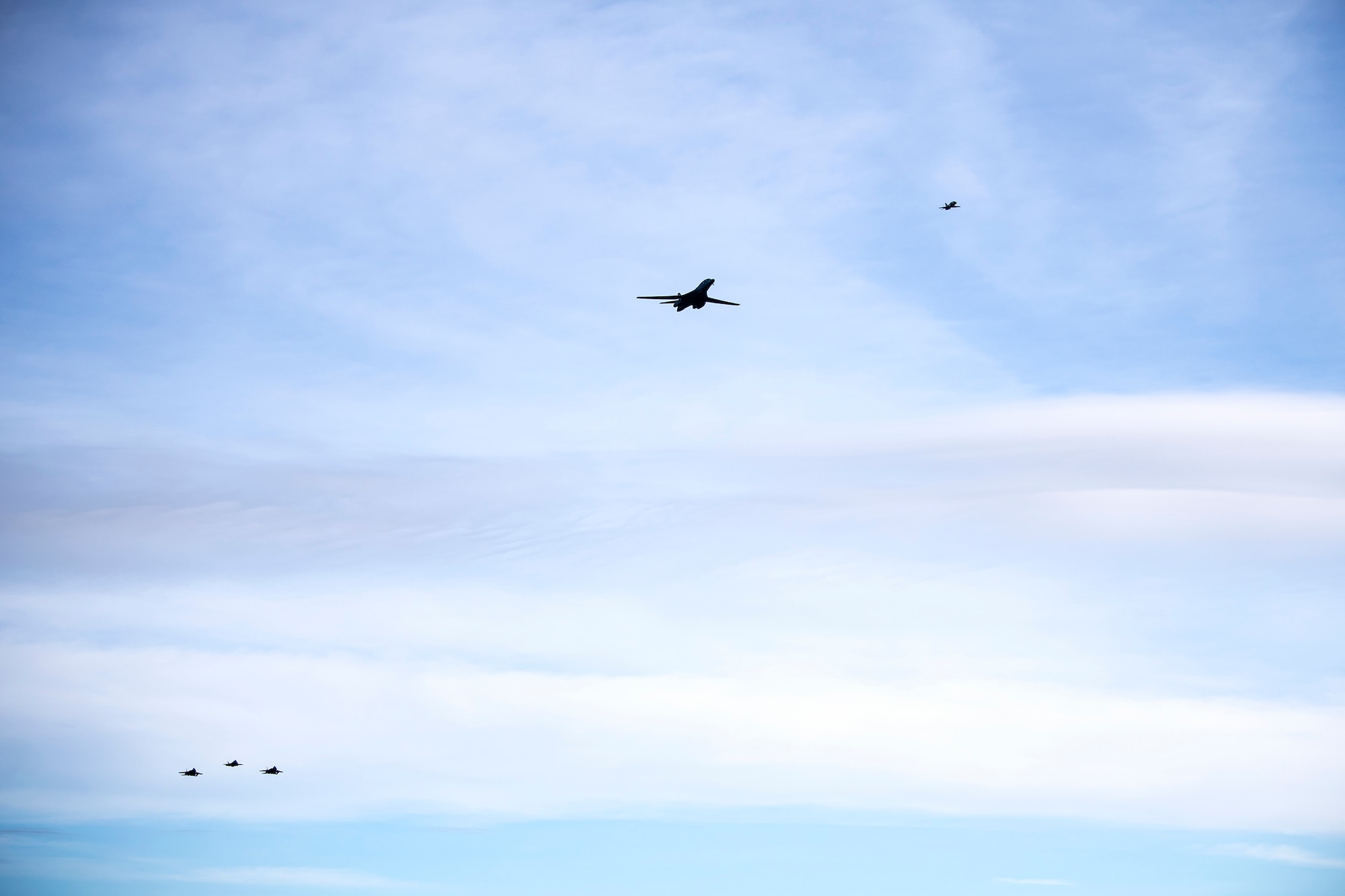 Aircraft from the U.S. Air Force and the Royal Air Force fly overhead at Duxford Airfield, England, Feb. 1, 2021. The flyover was in commemoration of the 80th anniversary of the Eighth Air Force. Events like these celebrate the continued USAF-RAF partnership and observe dissimilar US and RAF aircraft integrating on approach to Duxford Airfield. (U.S. Air Force photo by Senior Airman Eugene Oliver)
