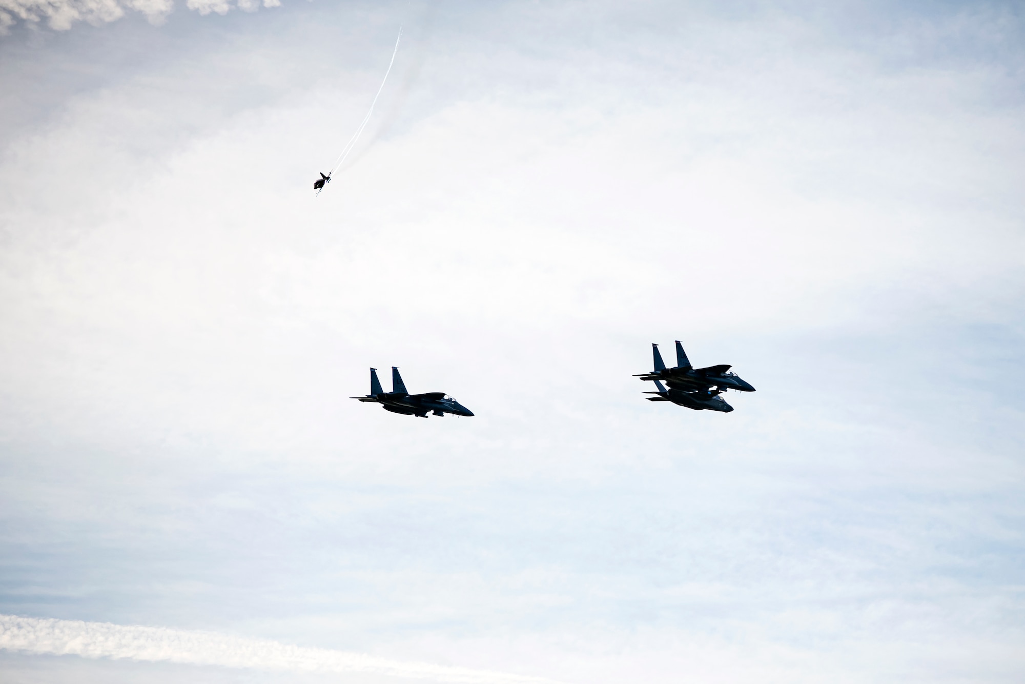 Aircraft from the U.S. Air Force and the Royal Air Force fly overhead at Duxford Airfield, England, Feb. 1, 2021. The flyover was in commemoration of the 80th anniversary of the Eighth Air Force. Events like these celebrate the continued USAF-RAF partnership and observe dissimilar U.S. and RAF aircraft integrating on approach to Duxford Airfield. (U.S. Air Force photo by Senior Airman Eugene Oliver)