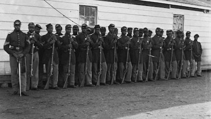 Black soldiers with the Union Army's 36th Colored Regiment stand in formation during the Civil War's Battle of Chaffin's Farm in Virginia, Sept. 29-30, 1864.