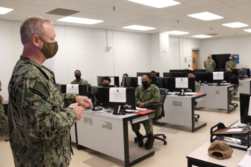 Rear Adm. Stuart C. Satterwhite, commander, MyNavy Career Center, addresses a class of Personnel Specialist “A” School students during a command tour of Naval Technical Training Center Meridian.  During his visit, Satterwhite also visited with Logistics Specialist “A” School students and toured classroom facilities including a mock of shipboard laundry facilities.