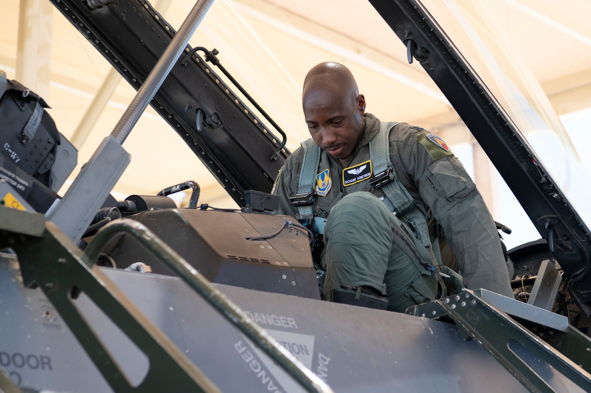 Maj. Richard Agbeyibor, AirMaj. Richard Agbeyibor, Air Force Test Center assistant director of Operations of the Multi-Domain Test Force, prepares for a flight at Edwards Air Force Base, Calif., June 8, 2021.