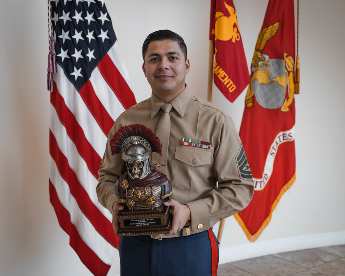 U.S. Marine Corps Gunnery Sgt. Izhar Weaver with Recruiting Station Sacramento was presented the Centurion Award Jan. 3, 2022. The title "Centurion" is only awarded to Marines who write 100 or more contracts during their 36 months on recruiting duty. (U.S. Marine Corps photo by Sgt. Jocelyn Ontiveros)