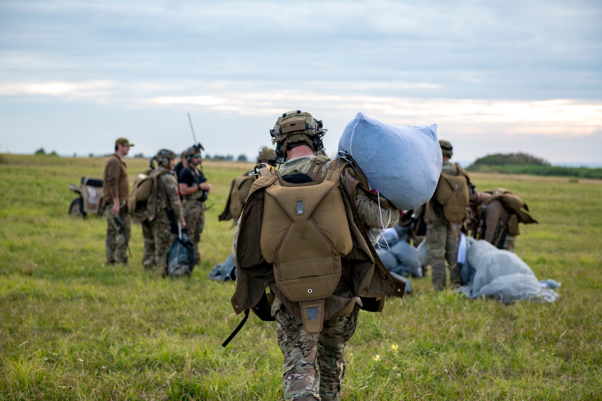 A U.S. Air Force Special Forces member walks back towards his team on Ie Shima Island, Japan