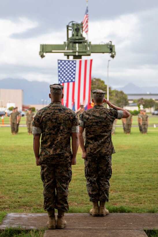 Combat Logistics Company 33 leadership report in front of the new CLC-33 guidon during a ceremony, Dewey Square, Marine Corps Base Hawaii, Jan. 28, 2022. The ceremony officially renamed Support Company, Combat Logistics Battalion 3, to Combat Logistics Company 33, Combat Logistics Regiment 37. 3d MLG, based in Okinawa, Japan, is a forward-deployed combat unit that serves as III Marine Expeditionary Force’s comprehensive logistics and combat service support backbone for operations throughout the Indo-Pacific area of responsibility. (U.S. Marine Corps photo by Cpl. Jose Angeles)
