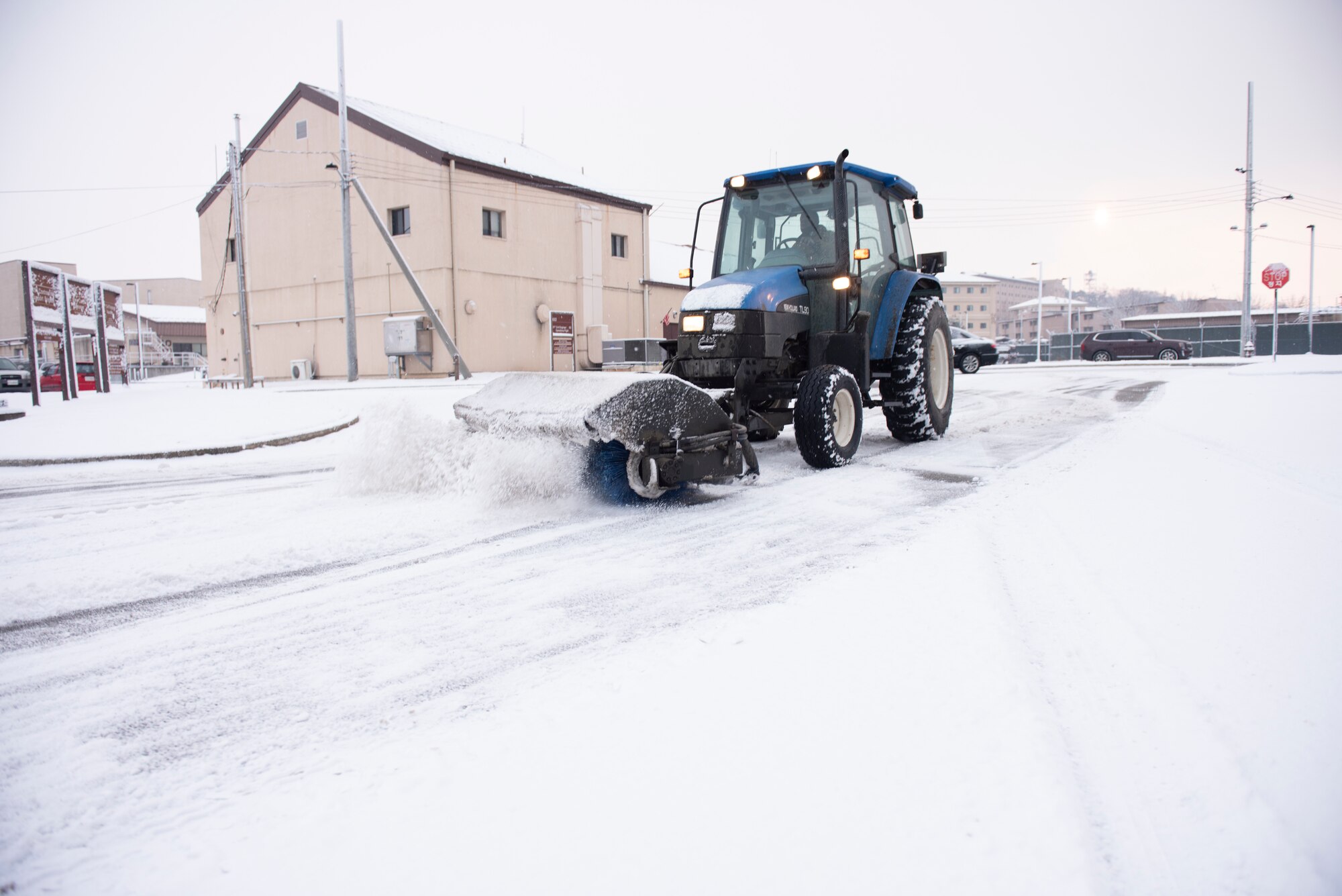 Staff Sgt. Masroy Plowright, 51st Civil Engineering Squadron pavement and equipment technician, clears the roads of snow