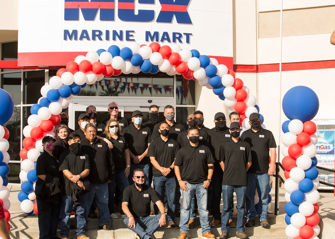 The Marine Corps Air Station Miramar’s Marine Corps Community Services contractors pose for a photo at the grand reopening of the Elrod Marine Mart on MCAS Miramar, San Diego, California, May 7, 2021. The station community attended a ribbon-cutting ceremony celebrating the grand reopening of the local Marine Mart where prizes and free samples were given away. (U.S. Marine Corps photo by Lance Cpl. Jose S. GuerreroDeleon)
