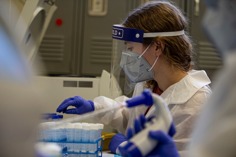 Gabby Blazek, a laboratory technician with the Naval Medical Research Center Silver Spring, processes laboratory specimens on Camp Foster, Okinawa, Japan, Jan. 24, 2022. The COVID-19 Health Action Response for Marines study was founded in May 2020 to assist the Marine Corps manage the COVID-19 outbreaks at the recruit depots and to monitor the health of recruits who tested positive for the virus. The second iteration of the study was launched soon after, and deployed to over 15 bases around the U.S. and in Okinawa to follow up and monitor the long-term effects those recruits, now Marines, may be experiencing. (U.S. Marine Corps photo by Lance Cpl. Alex Fairchild)