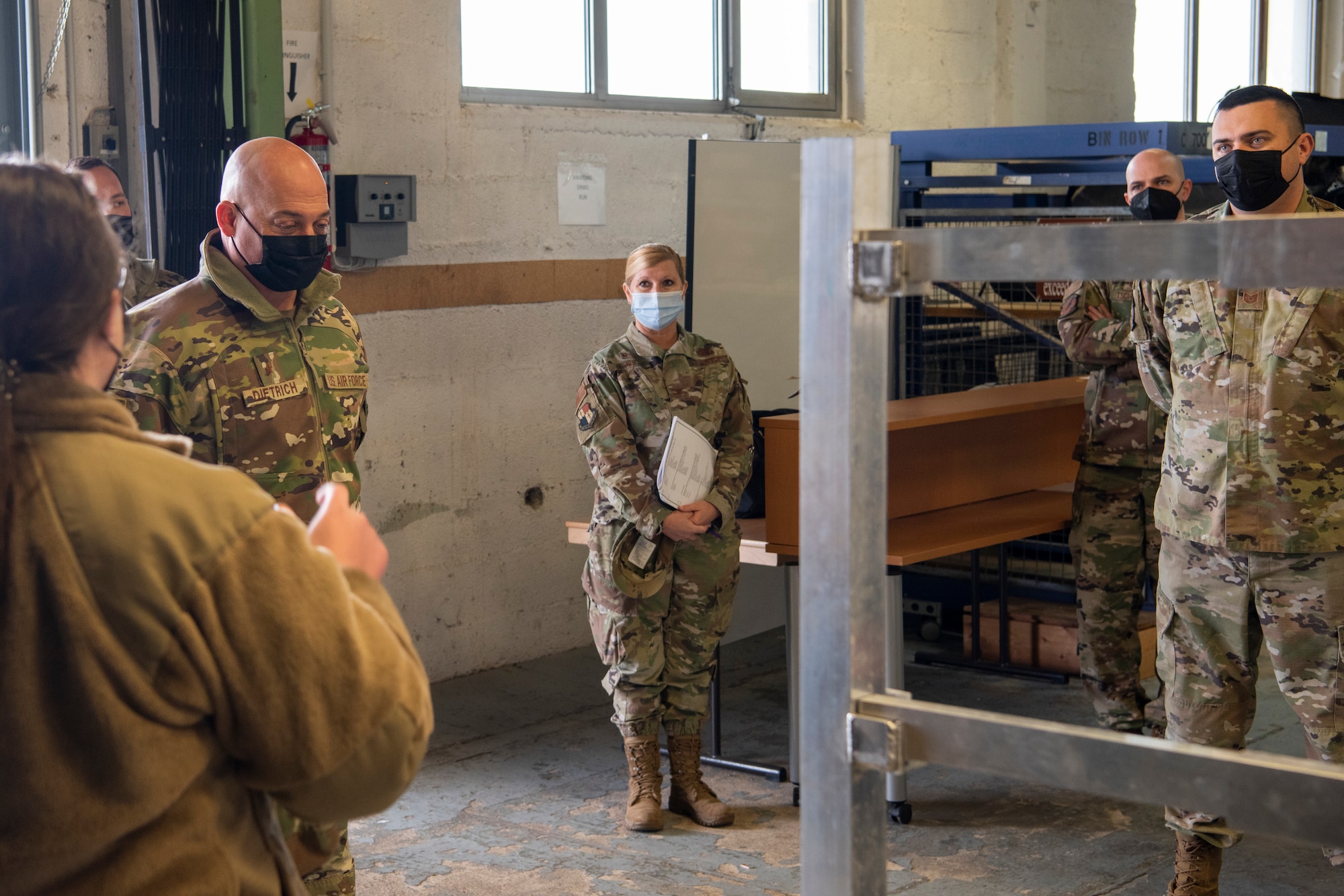 U.S. Air Force Brig. Gen. George T. Dietrich III, U.S. Air Forces in Europe - Air Forces Africa director of logistics, engineering and force protection, left center, receives a brief from Maj. Katherine Wilson, 52nd Logistics Readiness Squadron director of operations, left, on Project Rubicon, Jan. 25, 2022, at Spangdahlem Air Base, Germany.