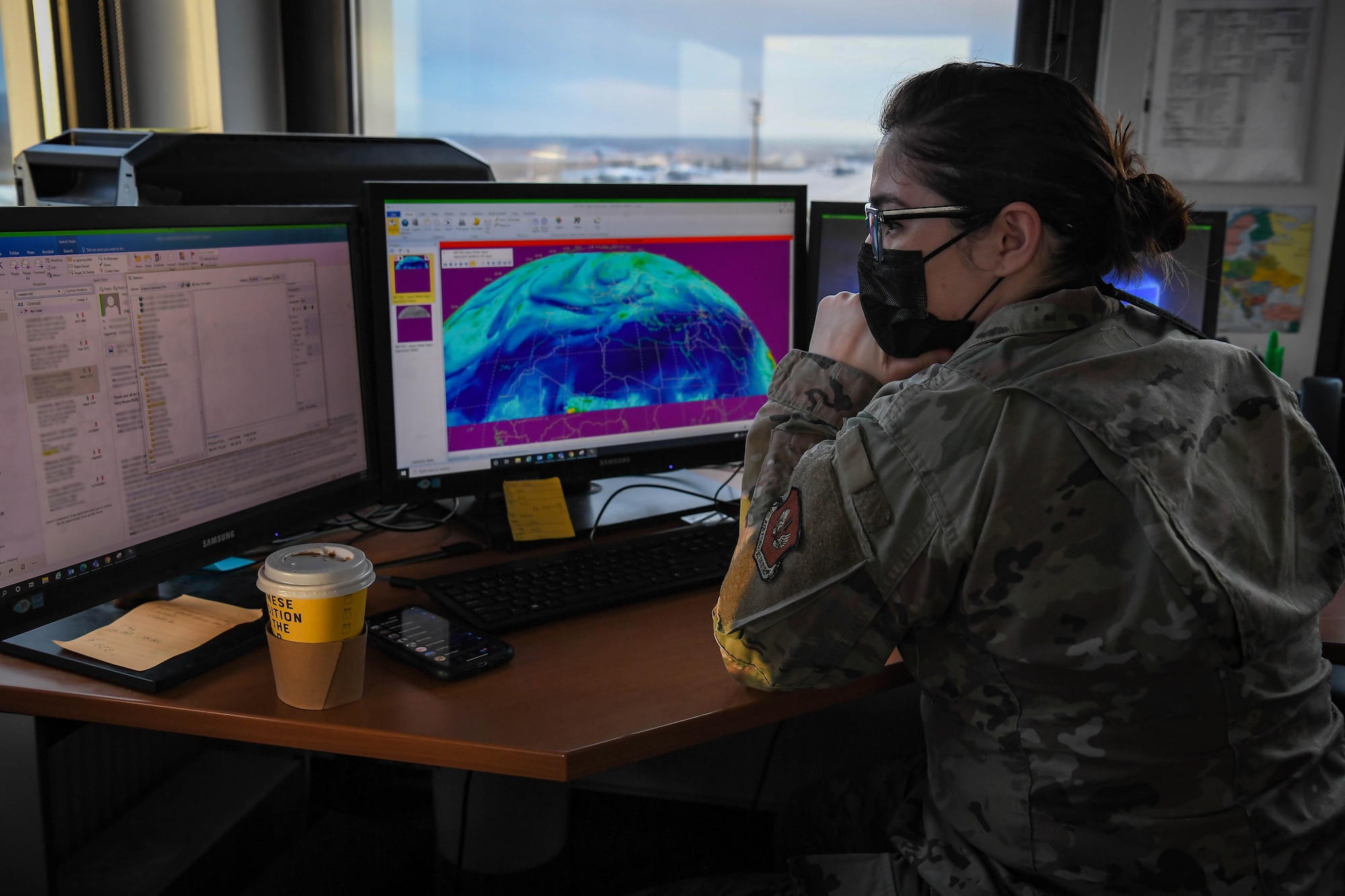U.S. Air Force Capt. Martiza Andicoechea, 86th Operations Support Squadron weather flight commander, analyzes water vapor from satellite imagery at Ramstein Air Base, Germany, Jan. 20, 2022. Weather specialists predict weather patterns and communicate the information to pilots to ensure a successful mission. (U.S. Air Force photo by Airman 1st Class Jared Lovett)
