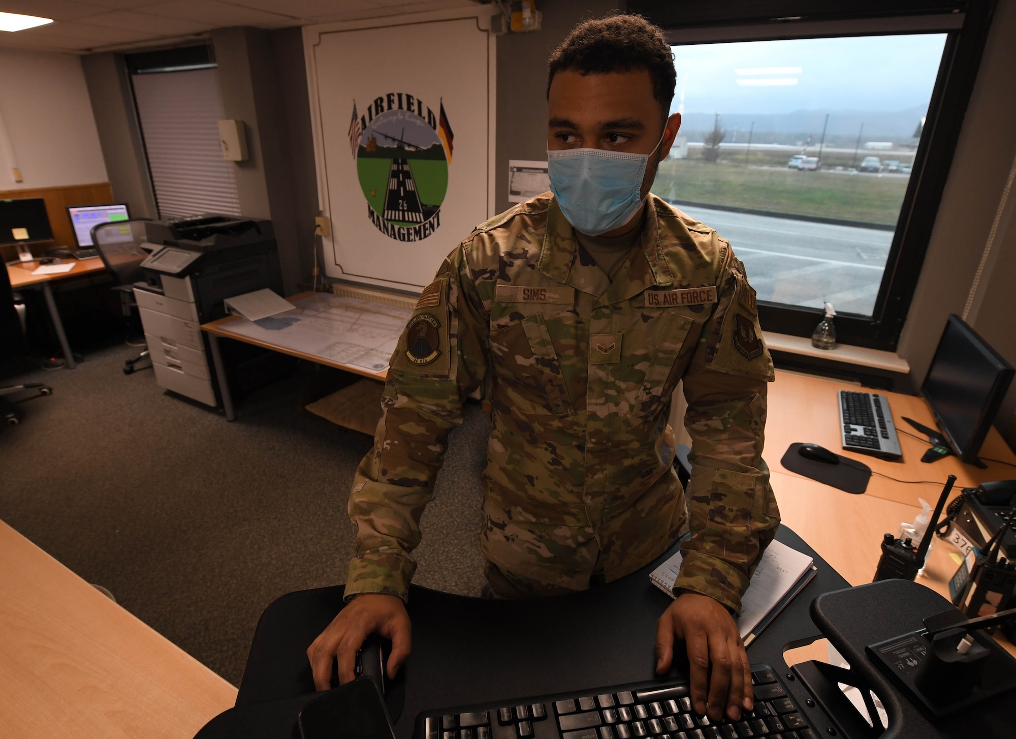 U.S. Air Force Airman 1st Class Broderick Sims, 86th Operations Support Squadron airfield management shift lead, files information regarding airfield hazards at Ramstein Air Base, Germany, Jan. 20, 2022. Airfield management Airmen are responsible for the upkeep of the runway and ensure that it is up to standard. (U.S. Air Force photo by Airman 1st Class Jared Lovett)