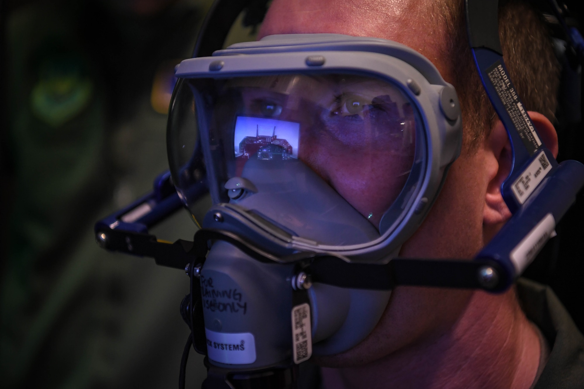 U.S. Air Force Maj. Frank Adamik, 76th Airlift Squadron pilot, undergoes physiological refresher training at Ramstein Air Base, Germany, Jan. 27, 2022. The hypoxia familiarization training puts pilots through a simulated flying experience in an unpressurized environment, restricting the amount of oxygen in the cabin. This training allows pilots to become familiar with hypoxia symptoms and emergency procedures that allow them to continue flying the aircraft under these circumstances. (U.S. Air Force photo by Airman 1st Class Jared Lovett)