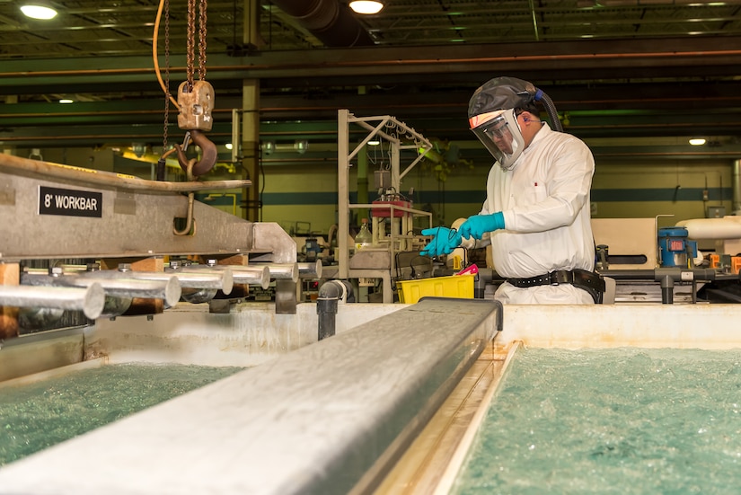 Photo of Chemical Engineer Bobby Diep conducting analysis in Tobyhanna's plating shop.