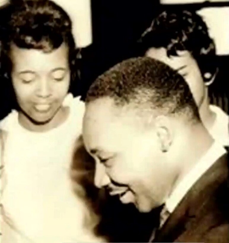 woman smiles at Martin Luther King