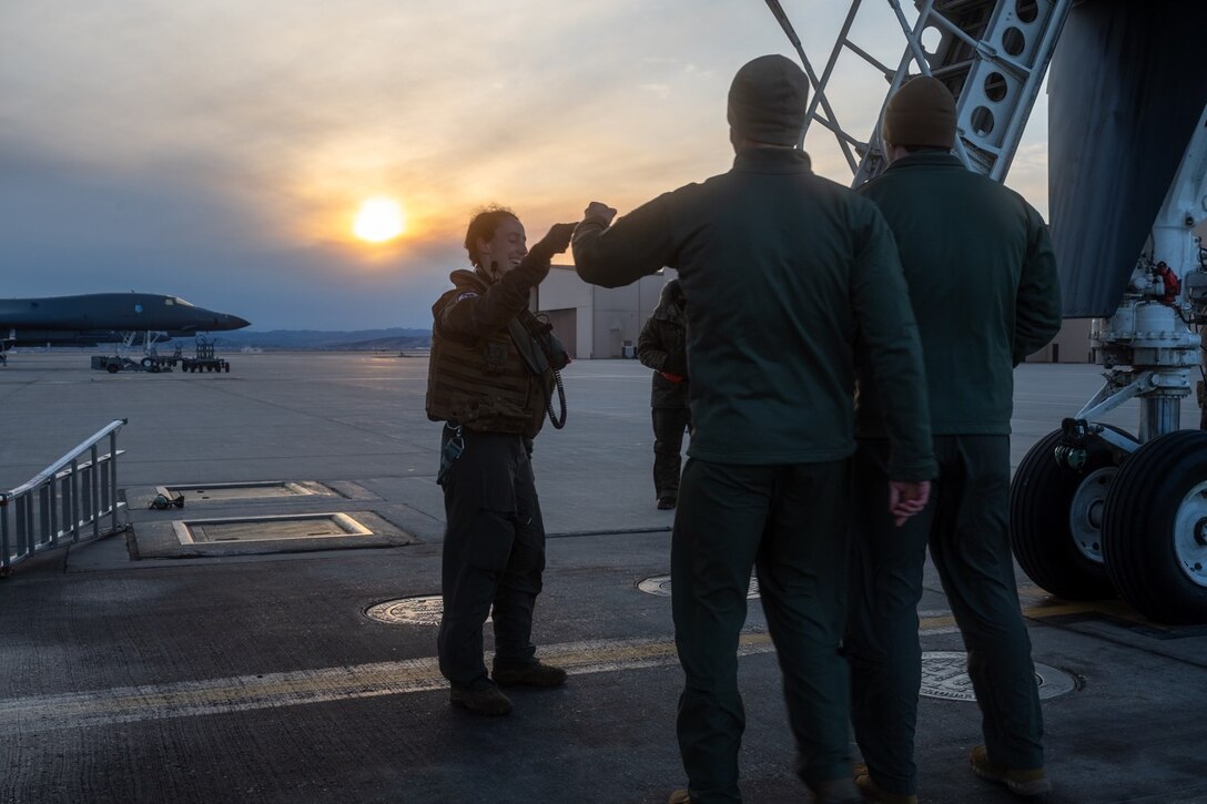 1st Lt. Meaghan Dowd, 34th Bomb Squadron aircrew member, is greeted upon her return from a Bomber Task Force mission at Ellsworth Air Force Base, S.D., Feb. 1, 2022.