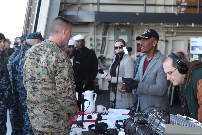 Men talk during a ship tour.