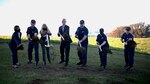 Participants in the ground breaking ceremony shovel dirt, to signify the beginning of the energy microgrid project on U.S. Coast Guard Training Center (TRACEN) Petaluma, California, Jan. 28, 2022. The goal of the project is to allow TRACEN Petaluma to be able to produce their own power for up to 10-days of independent and full operations through the installation of five megawatts of solar photovoltaic and 11.6 megawatt hours of battery storage. (U.S. Coast Guard photo by Petty Officer 3rd Class Taylor Bacon)