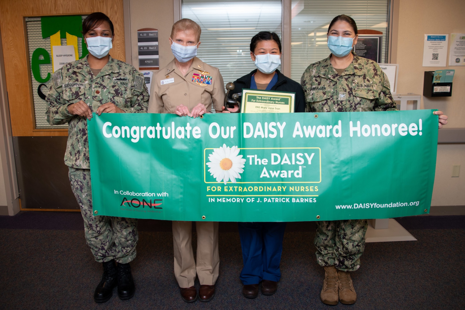 220131-N-ZM949-1007

Ensign Mary Jane Tran, a Naval Medical Center Portsmouth (NMCP) charge nurse assigned to the Mother Baby Unit, was surprised with the DAISY Award during a ceremony, Jan. 31. From the left, Lt. Cmdr. Mohneke Broughton, NMCP Maternal Child Infant department head; Capt. Shelley Perkins, NMCP’s commanding officer; Ensign Mary Jane Tran, Mother Baby Unit charge nurse; and Capt. Laura Lakshimi, NMCP’s Chief Nursing Officer and Nursing Services director.