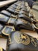 Rows of signed boxing gloves on a counter.