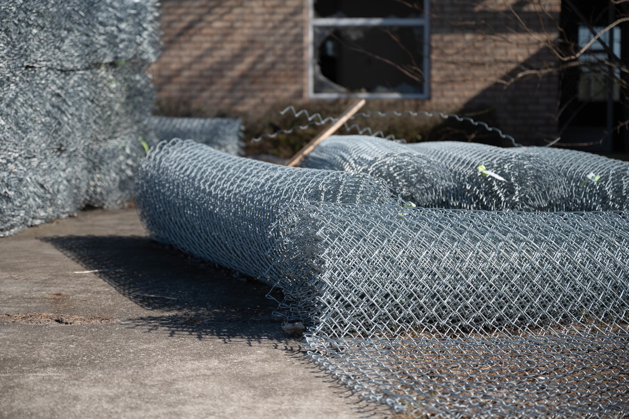 Fencing material sits outside a house