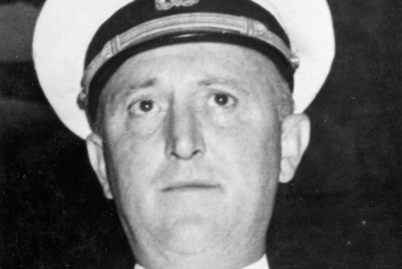 Three large recreations of Medals of Honor are displayed on a blue wall.