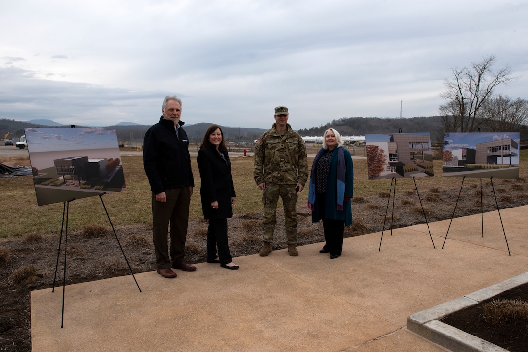 (Left to right) Ken Rueter, UCOR president and CEO, Laura Wilkerson; acting manager of the U.S. Department of Energy Office of Enviromental Management at Oak Ridge, Tennessee; Lt. Col. Joseph Sahl, U.S. Army Corps of Engineers Nashville District commander; and Stephanie Hall, Nashville District deputy district engineer; pose with artist renderings of a viewing platform Feb. 2, 2022 near the site of a future construction site for a viewing platform near the former site of the K-25 Building in Oak Ridge, Tennessee. (USACE Photo by Lee Roberts)