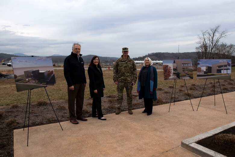 (Left to right) Ken Rueter, UCOR president and CEO, Laura Wilkerson; acting manager of the U.S. Department of Energy Office of Enviromental Management at Oak Ridge, Tennessee; Lt. Col. Joseph Sahl, U.S. Army Corps of Engineers Nashville District commander; and Stephanie Hall, Nashville District deputy district engineer; pose with artist renderings of a viewing platform Feb. 2, 2022 near the site of a future construction site for a viewing platform near the former site of the K-25 Building in Oak Ridge, Tennessee. (USACE Photo by Lee Roberts)