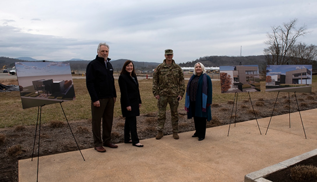 (Left to right) Ken Rueter, UCOR president and CEO, Laura Wilkerson; acting manager of the U.S. Department of Energy Office of Enviromental Management at Oak Ridge, Tennessee; Lt. Col. Joseph Sahl, U.S. Army Corps of Engineers Nashville District commander; and Stephanie Hall, Nashville District deputy district engineer; pose with artist renderings of a viewing platform Feb. 2, 2022 near the site of a future construction site for a viewing platform near the former site of the K-25 Building in Oak Ridge, Tennessee. (USACE Photo by Lee Roberts)