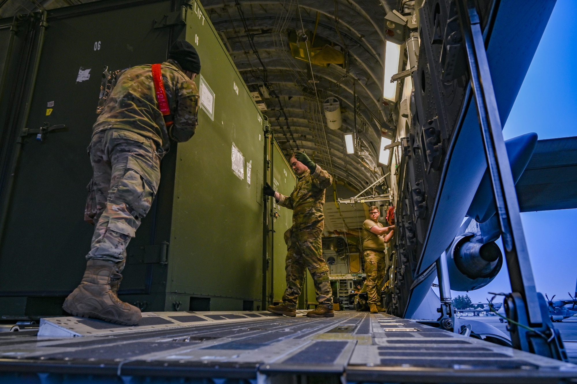 Airmen load a C-17 Globemaster III.