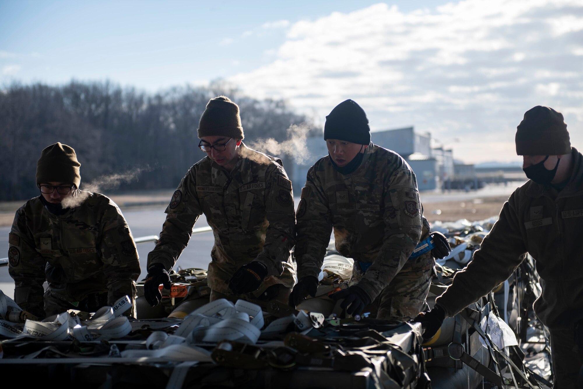 Airmen from the 436th Aerial Port Squadron load cargo bound for India during a foreign military sales mission at Dover Air Force Base, Delaware, Jan. 22, 2022. The United States and India relationship focus is to continue to build a strategic partnership to promote shared interests in the Indo-Pacific region and beyond. (U.S. Air Force photo by Tech. Sgt. J.D. Strong II)