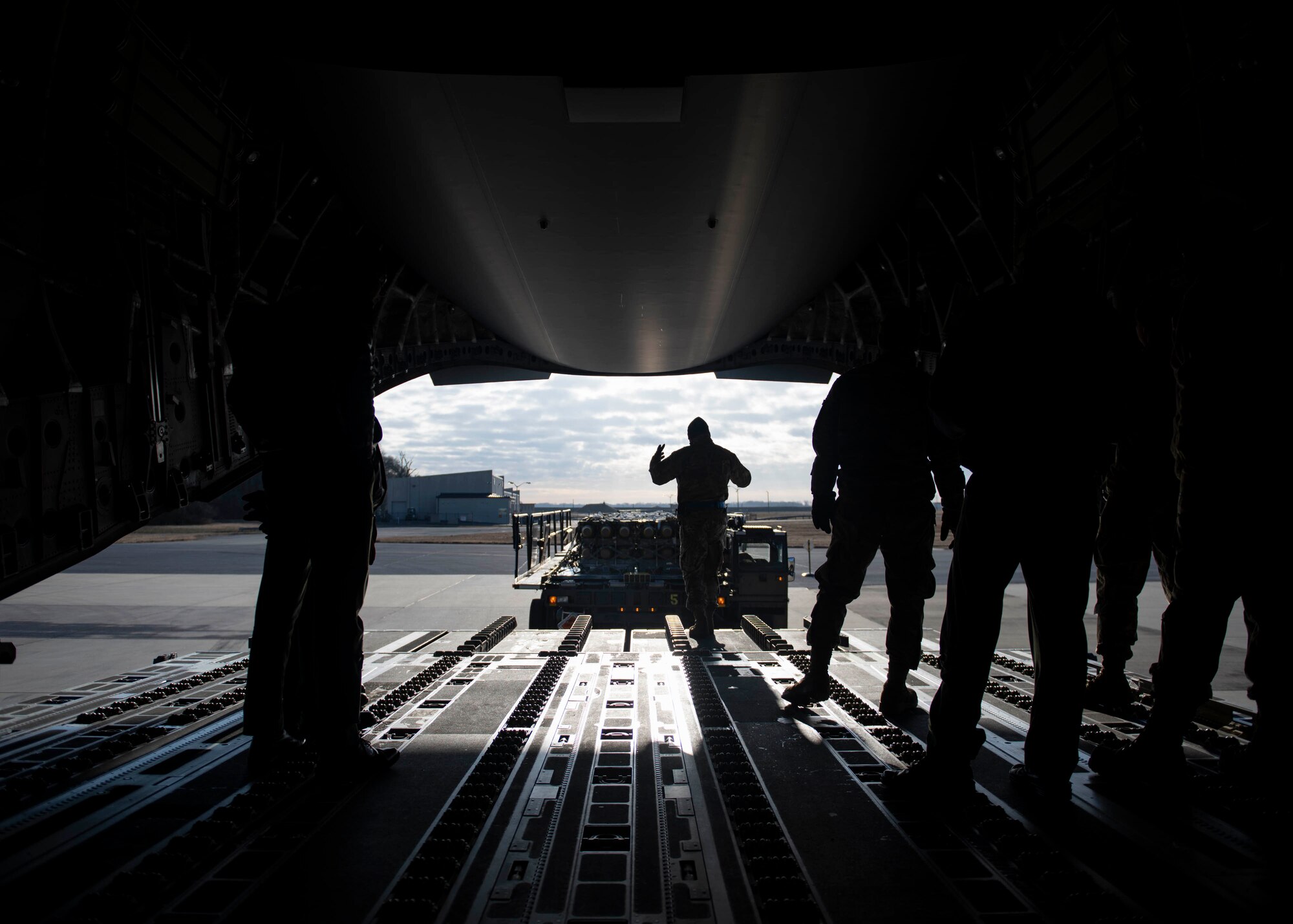 Staff Sgt. Dave Warry Servida 436th Aerial Port Squadron ramp service supervisor, guides a k-loader during as foreign military sales mission at Dover Air Force Base, Delaware, Jan. 22, 2022. Due to its strategic geographic location, Dover AFB supports approximately $3.5 billion worth of foreign military sales operations annually.
(U.S. Air Force photo by Tech. Sgt. J.D. Strong II)