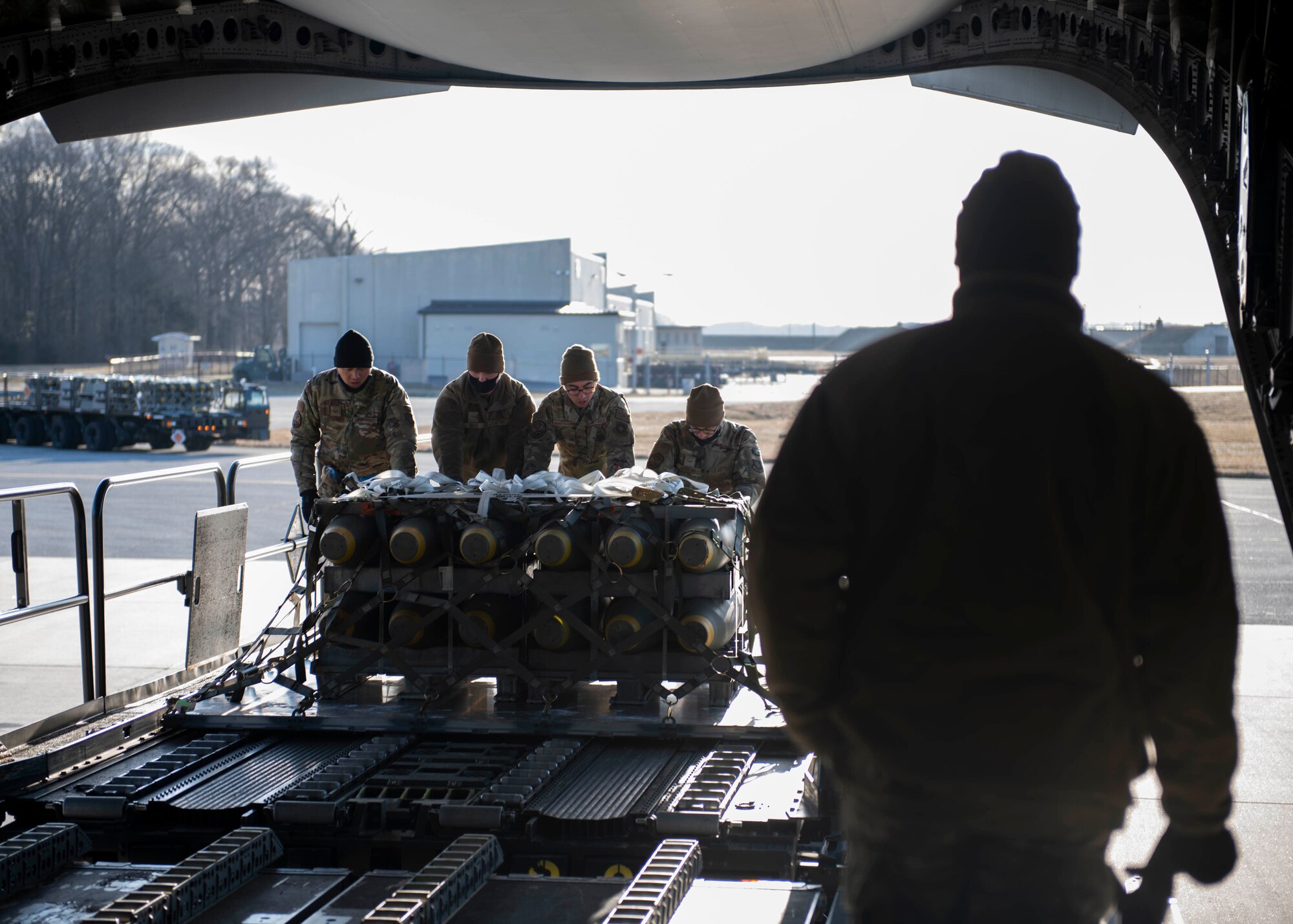 Airmen from the 436th Aerial Port Squadron load cargo during a foreign military sales mission with India at Dover Air Force Base, Delaware, Jan. 22, 2022. The United States and India relationship focus is to continue to build a strategic partnership to promote shared interests in the Indo-Pacific region and beyond. (U.S. Air Force photo by Tech. Sgt. J.D. Strong II)
