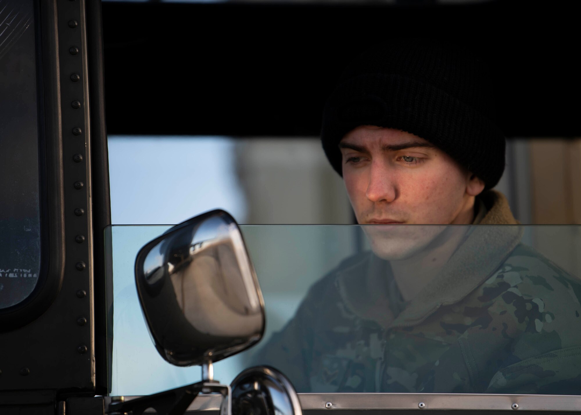 Airman 1st Class Kohl Reed, 436th Aerial Port Squadron ramp specialist, checks the mirror of his k-loader during a foreign military sales mission at Dover Air Force Base, Delaware, Jan. 22, 2022. Due to its strategic geographic location, Dover AFB supports approximately $3.5 billion worth of foreign military sales operations annually.
(U.S. Air Force photo by Tech. Sgt. J.D. Strong II)