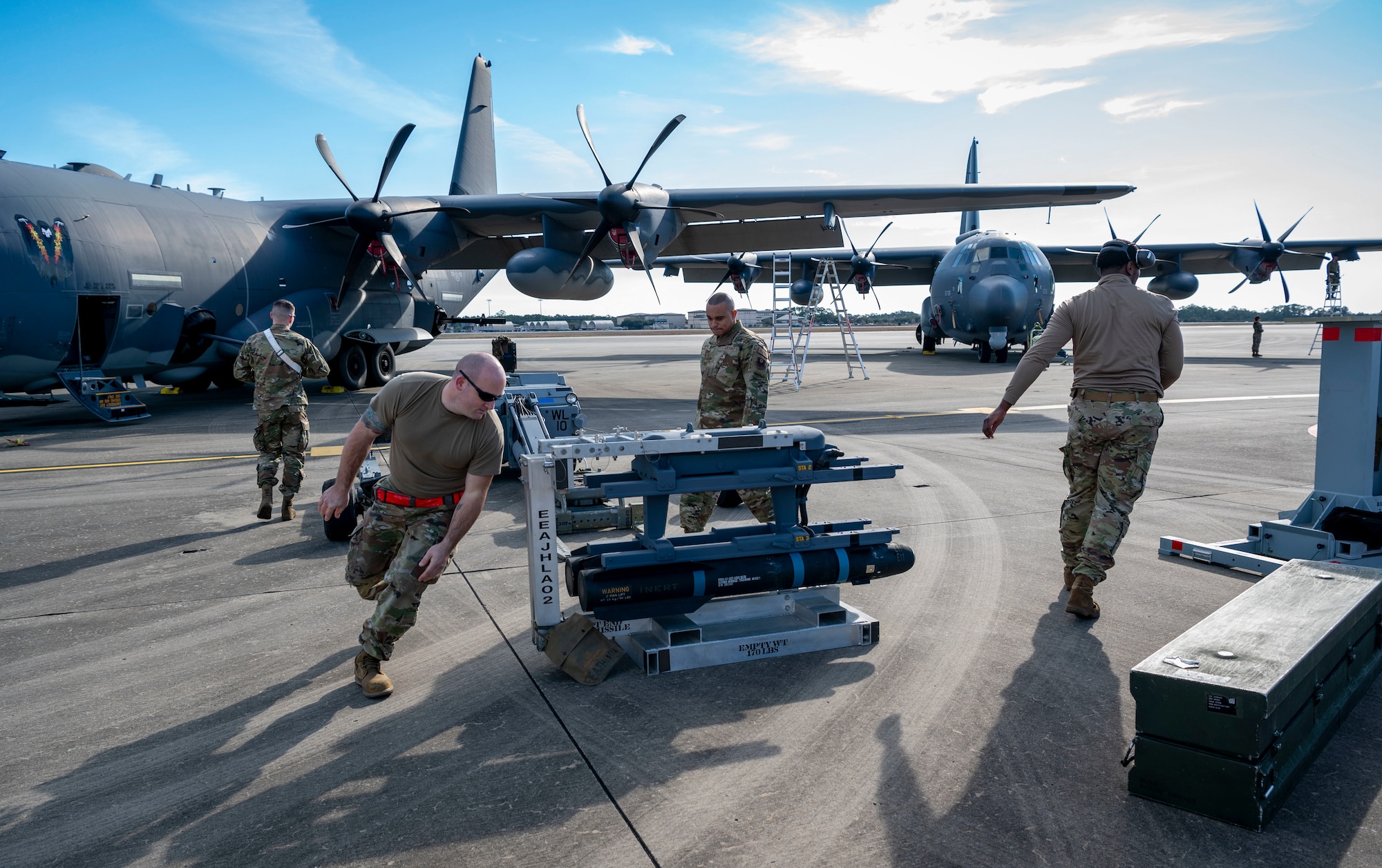 Members of the 4th Aircraft Maintenance Unit, assigned to the 1st Special Operations Maintenance Group, compete for the title of 2022 Weapons Load Crew of the Year, Jan. 31, 2022, at Hurlburt Field, Florida.
