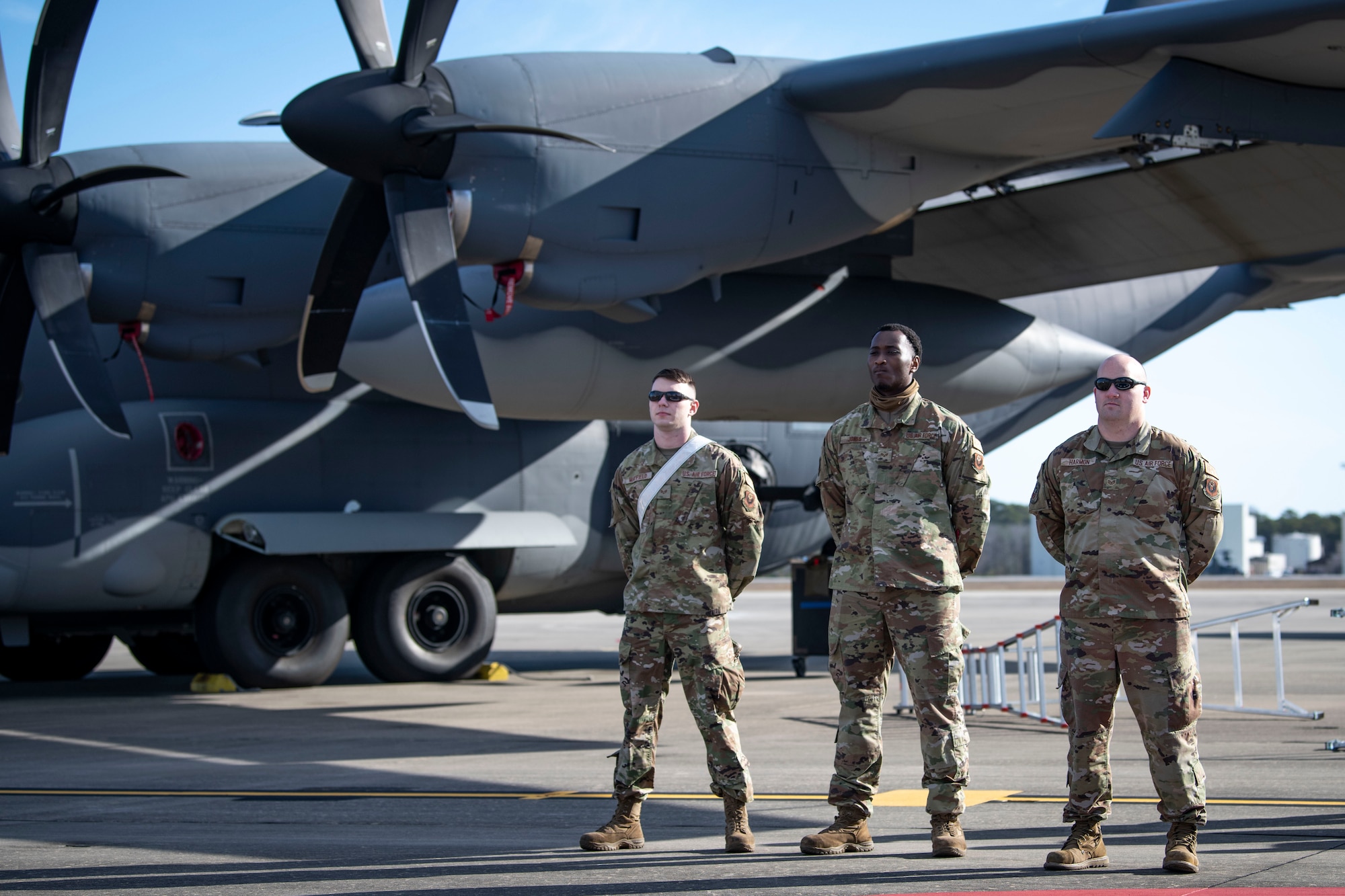 U.S. Air Force Airman 1st Class Ryian Mayfield, left, U.S. Air Force Senior Airman Jordan Jones, center, 4th Aircraft Maintenance Unit load crew members, and U.S. Air Force Staff Sgt. Matthew Harmon, right, a 4th AMU weapons load crew chief, are introduced during the 2022 Weapons Load Crew of the Year Competition, Jan. 31, 2022, at Hurlburt Field, Florida.