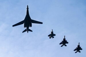 A U.S. Air Force B-1B Lancer assigned to 28th Bomb Wing and two F-15E Strike Eagles assigned to the 492nd and 494th Fighter Squadrons as well as a Royal Air Force F-35B Lightning conduct a flyover at Royal Air Force Lakenheath, England, Feb. 1, 2022.