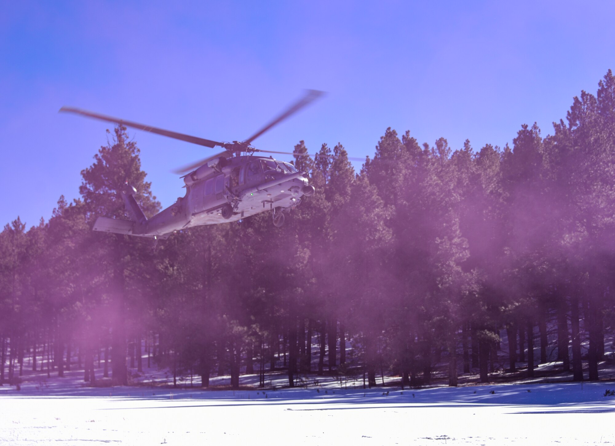 a photo of a helicopter landing in snow