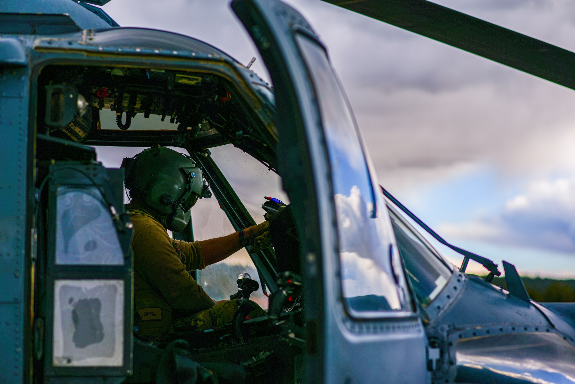 a photo of a pilot in a helicopter