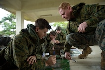 Sgt. Edgar Alvarez, a scout sniper with Battalion Landing Team 1/5, 31st Marine Expeditionary Unit gathers necessary gear for a two-day area reconnaissance mission at the Jungle Warfare Training Center in Okinawa, Japan, Jan. 11, 2022. Scout snipers play an integral part in the Stand in Force Concept operating as the eyes and ears of the ground force commander, allowing for a more efficient decision making process. The 31st MEU, the Marine Corps' only continuously forward-deployed MEU, provides a flexible and lethal force ready to perform a wide range of military operations as the premiere crisis response force in the Indo-Pacific region.