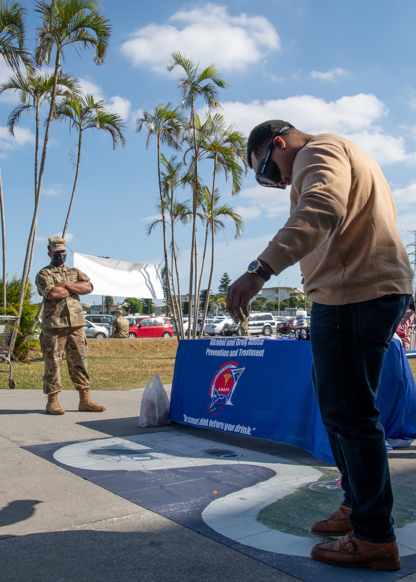 A participant attempts a sobriety test.