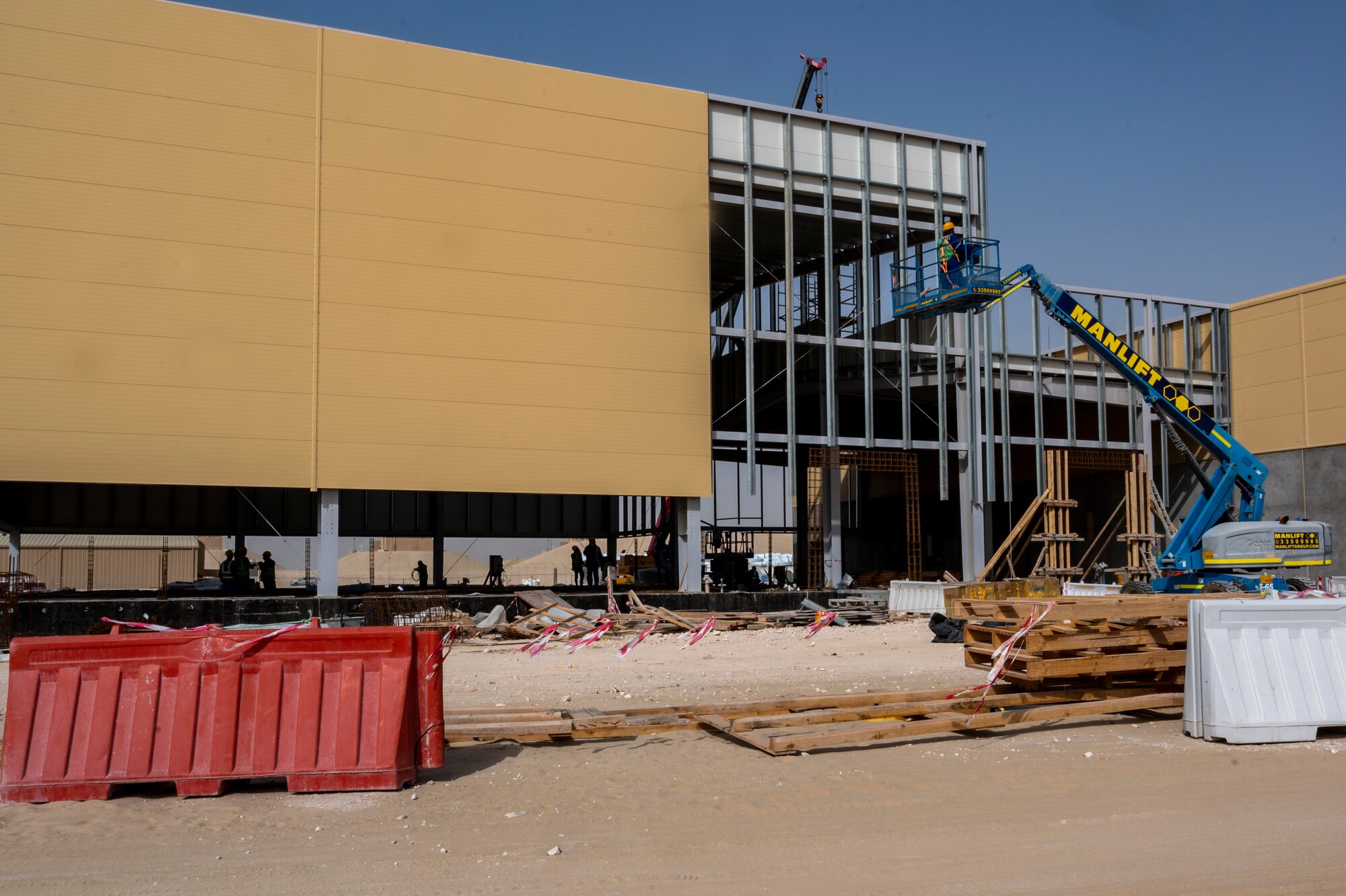 Qatar Emiri Corps of Engineers subcontractors continue construction on a dining facility at Al Udeid Air Base, Qatar
