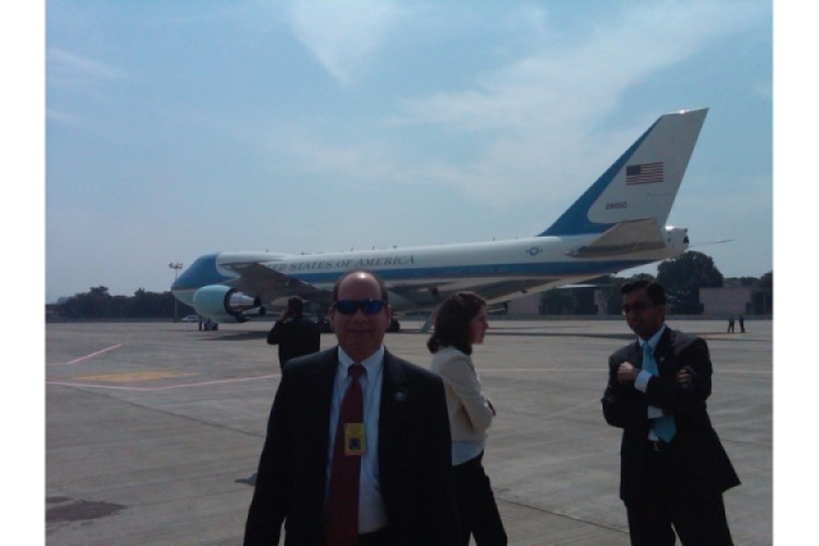 Danoy stands in front of Air Force One during a trip to Mumbai, India.