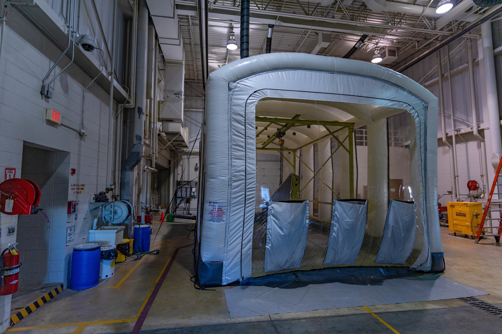 F-16C wing dries after being painted in a portable paint booth assembled by the 114th Structural Repair shop. The portable paint booth has saved the wing money and time for structural repair Airmen. (U.S. Air National Guard photo by Master Sgt. Duane Duimstra)