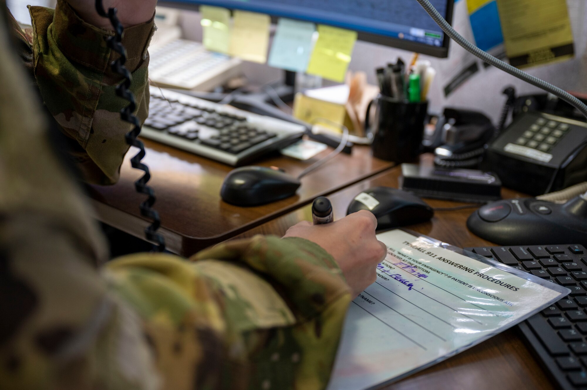 A man's hand documenting information