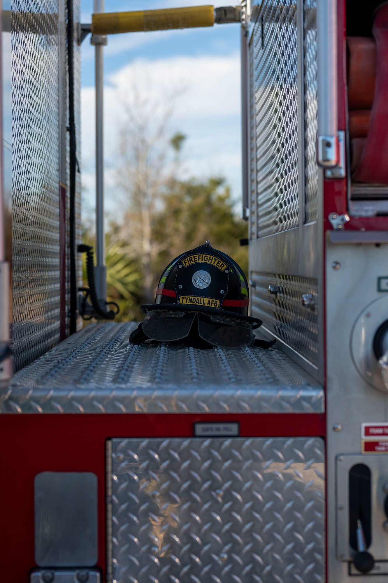 A firefighter's helmet on the deck of a fire engine