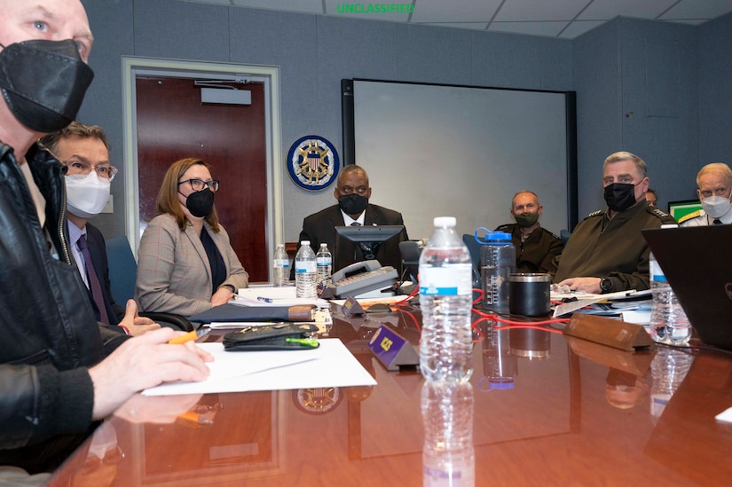 Secretary of Defense Lloyd J. Austin III and Chairman of the Joint Chiefs of Staff Mark A. Milley sit in a meeting.