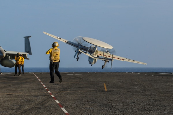 An E-2D Hawkeye, assigned to the "Wallbangers" of Carrier Airborne Early Warning Squadron (VAW) 117, launches from the flight deck of the Nimitz-class aircraft carrier USS Abraham Lincoln (CVN 72).