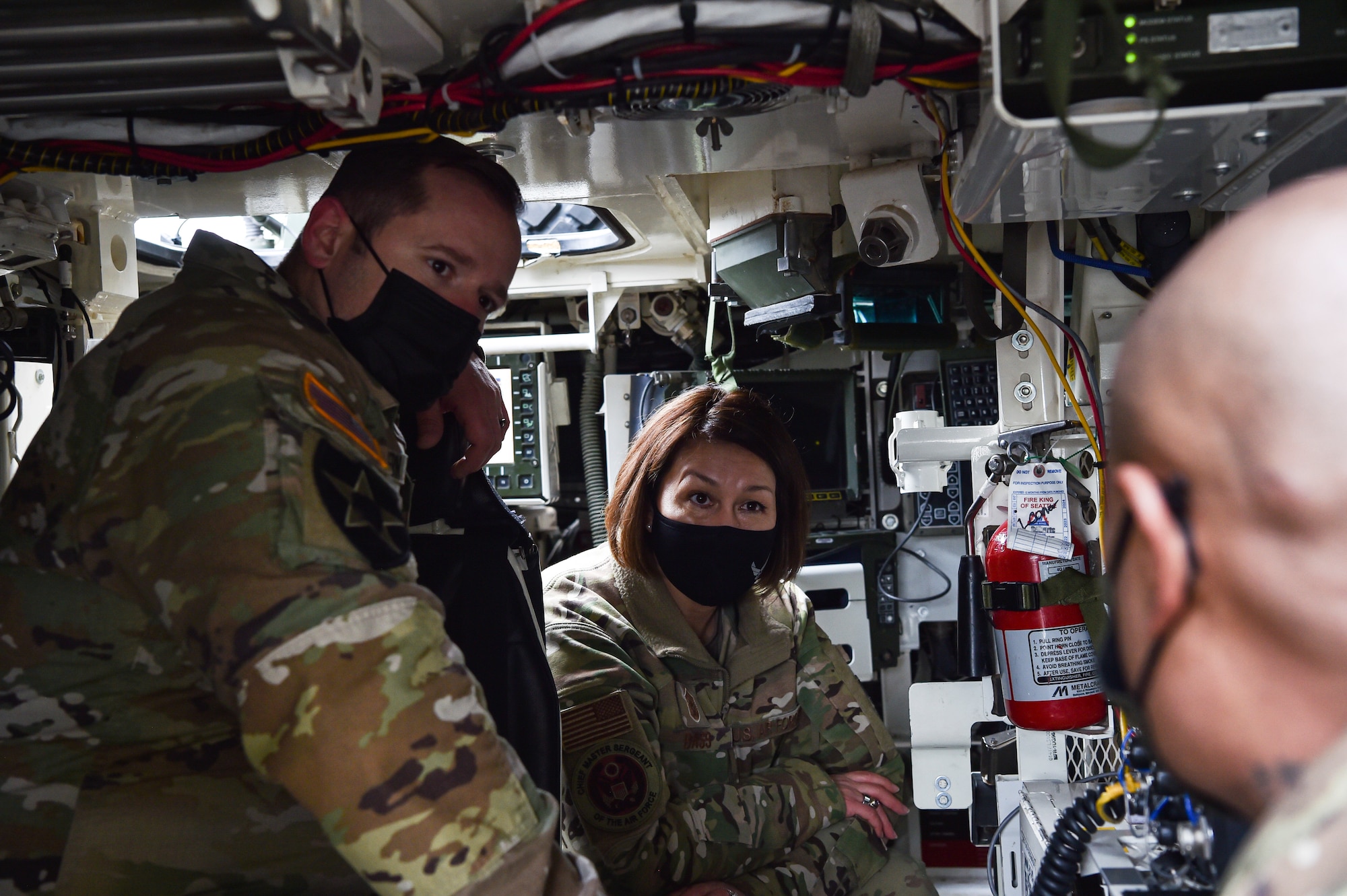 Chief Master Sergeant of the Air Force JoAnne S. Bass engages with Army Soldiers during her visit at Joint Base Lewis-McChord, Washington, Feb. 1, 2022. Bass toured several McChord units and recognized Airmen for excellent performance. (U.S. Air Force photo by Staff Sgt. Tryphena Mayhugh)