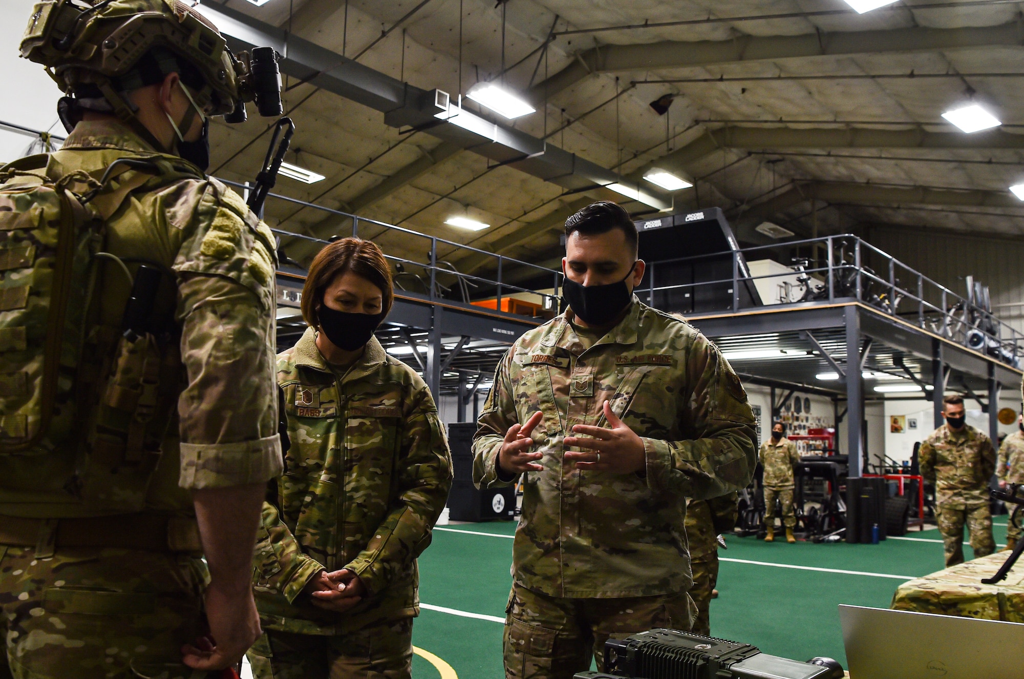 Chief Master Sergeant of the Air Force JoAnne S. Bass receives a tour of the Human Performance Facility from Tech. Sgt. Spencer Torres, 22nd Special Tactics Squadron radar airfield weather systems, during her visit to McChord Field at Joint Base Lewis-McChord, Washington, Feb. 1, 2022. Bass toured several McChord units and recognized Airmen for excellent performance. (U.S. Air Force photo by Staff Sgt. Tryphena Mayhugh)