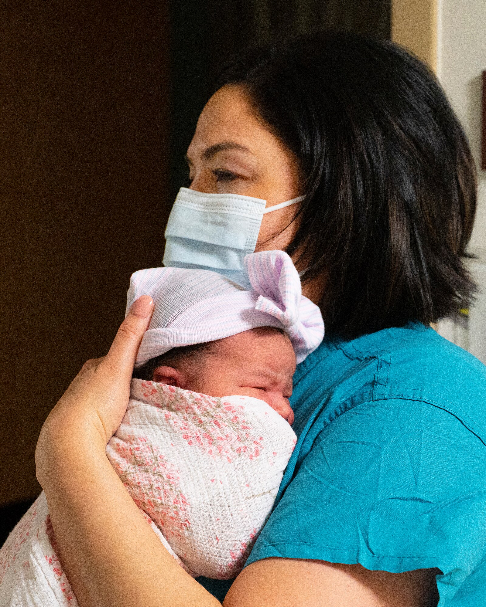 Capt. Dahlia Garcia, 88th Inpatient Operations Squadron charge nurse, holds 1-day-old Kalea Izzie Wallace on Jan. 5, 2022, during the night shift at Wright-Patterson Medical Center’s Labor and Delivery Ward. Kalea, the daughter of Patience Mantor and Army Spc. Cody Wallace, Ohio National Guard, was the first baby of the year born at the base hospital. (U.S. Air Force photo by R.J. Oriez)