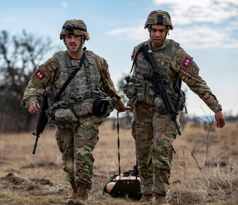 U.S. Army Sgt. Ethan Hart and Staff Sgt. Dylan Delamarter, 2nd Battalion, 108th Infantry, 27th Infantry Brigade Combat Team, New York Army National Guard, transport a simulated casualty during the Army's Best Medic Competition at Fort Hood, Texas, Jan. 27, 2022. Twenty-two two-Soldier teams from around the world competed in the finals to be named the Army’s Best Medic.